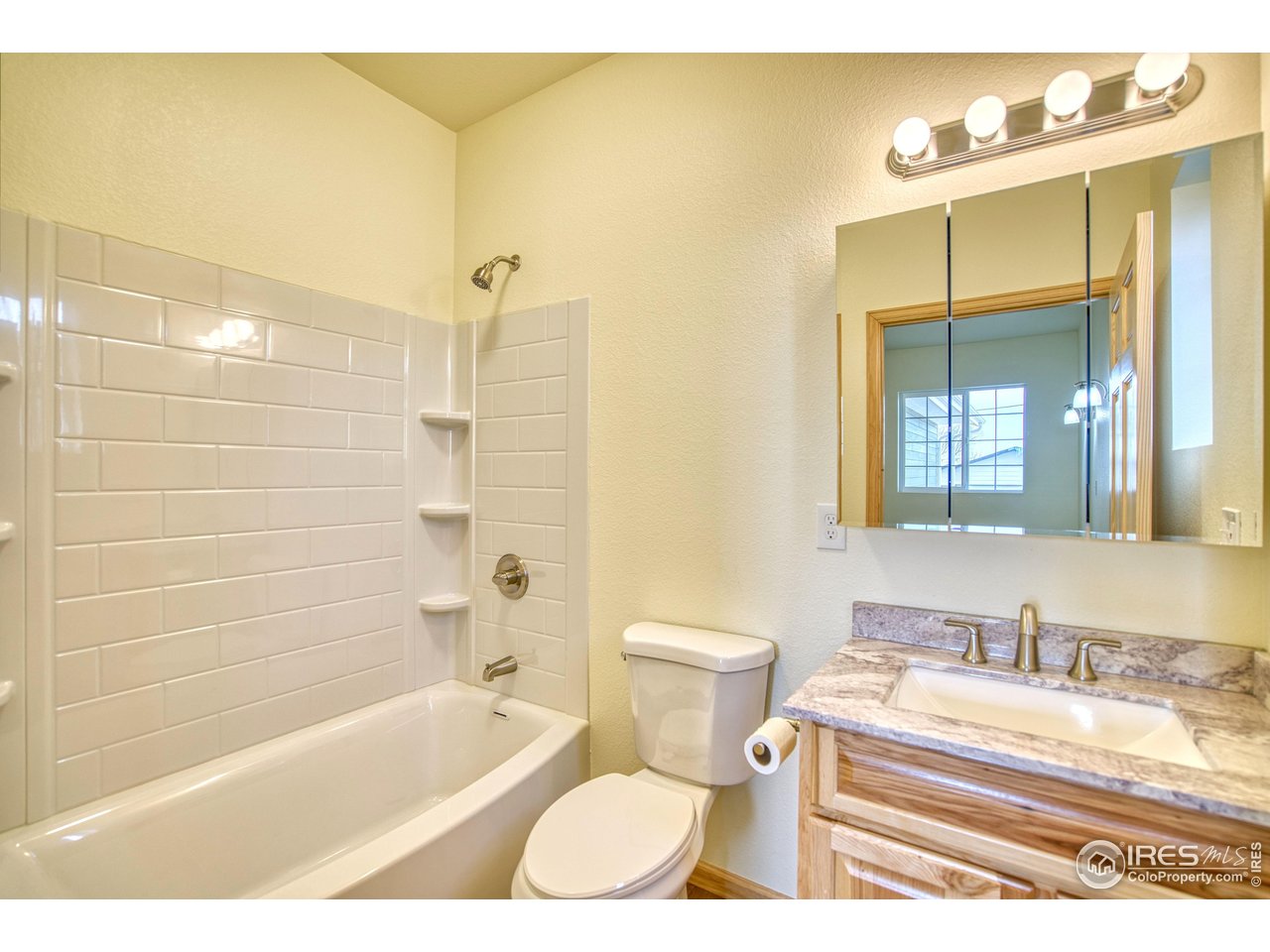 126 2nd Street Mead, CO 80542 - Photo 16 of 22 a bathroom with a sink and a bathtub