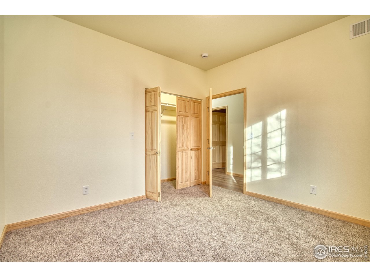 126 2nd Street Mead, CO 80542 - Photo 17 of 22 a view of an empty room and window