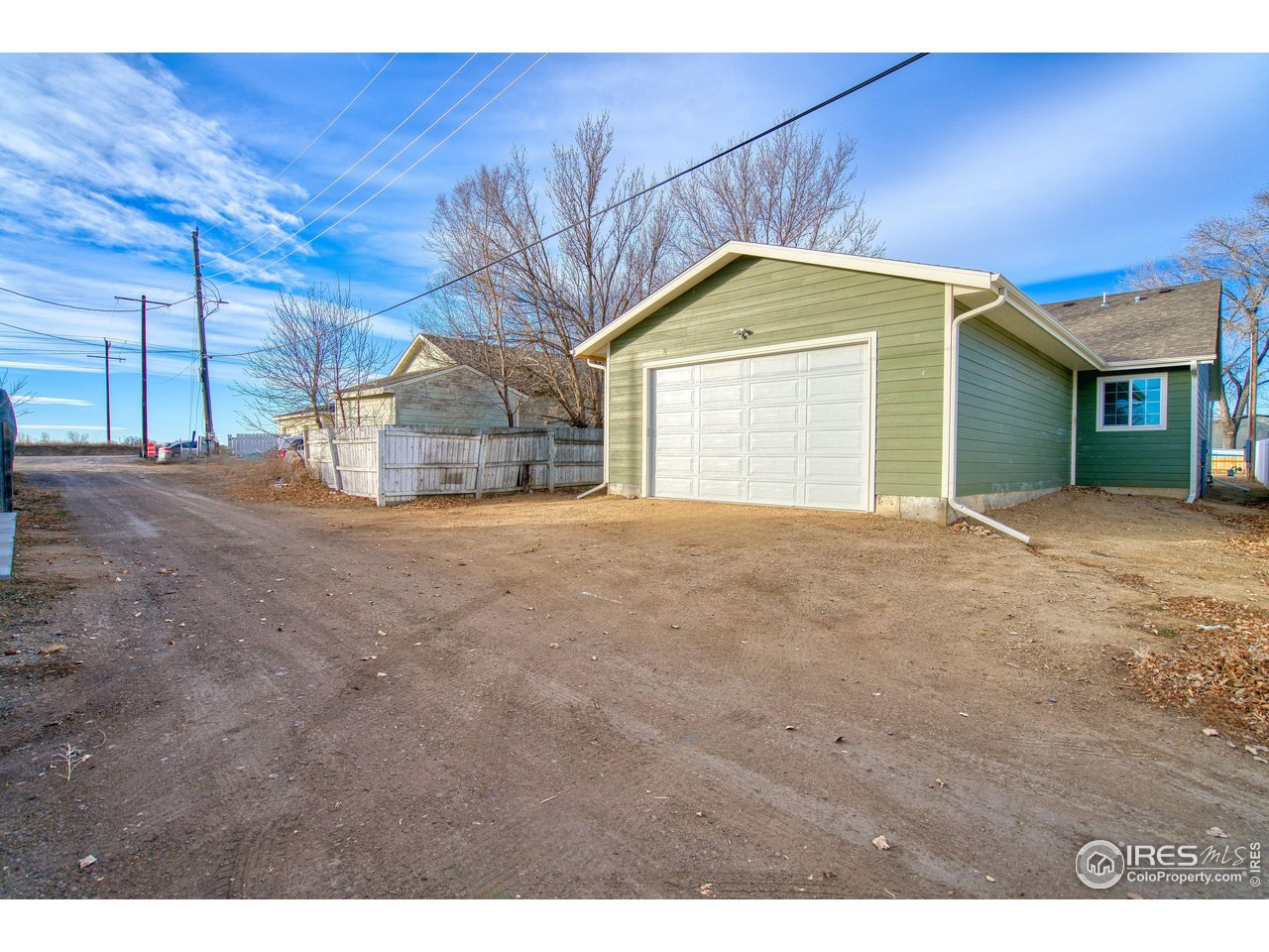 126 2nd Street Mead, CO 80542 - Photo 21 of 22 a view of a house with a yard and garage