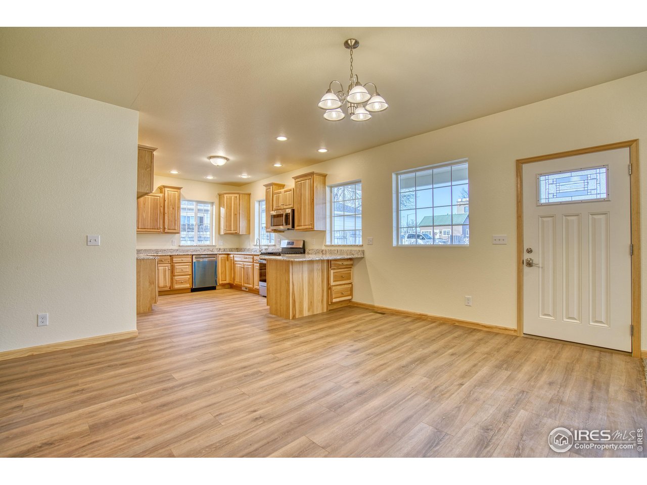126 2nd Street Mead, CO 80542 - Photo 4 of 22 a view of kitchen with cabinets and wooden floor