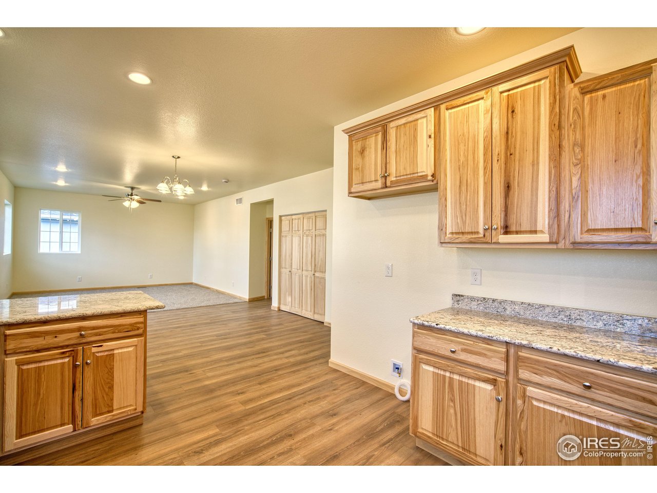 126 2nd Street Mead, CO 80542 - Photo 10 of 22 a bathroom with a granite countertop sink and a mirror