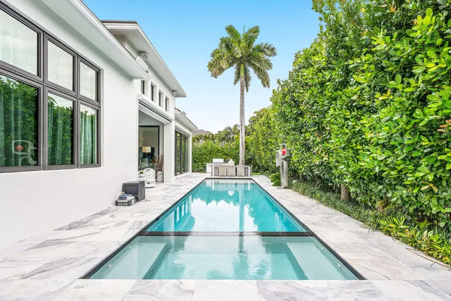 an aerial view of multiple houses with yard