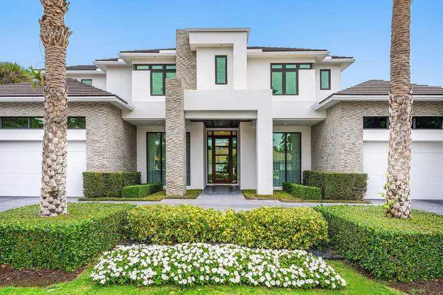 a living room with furniture a lamp and a large window