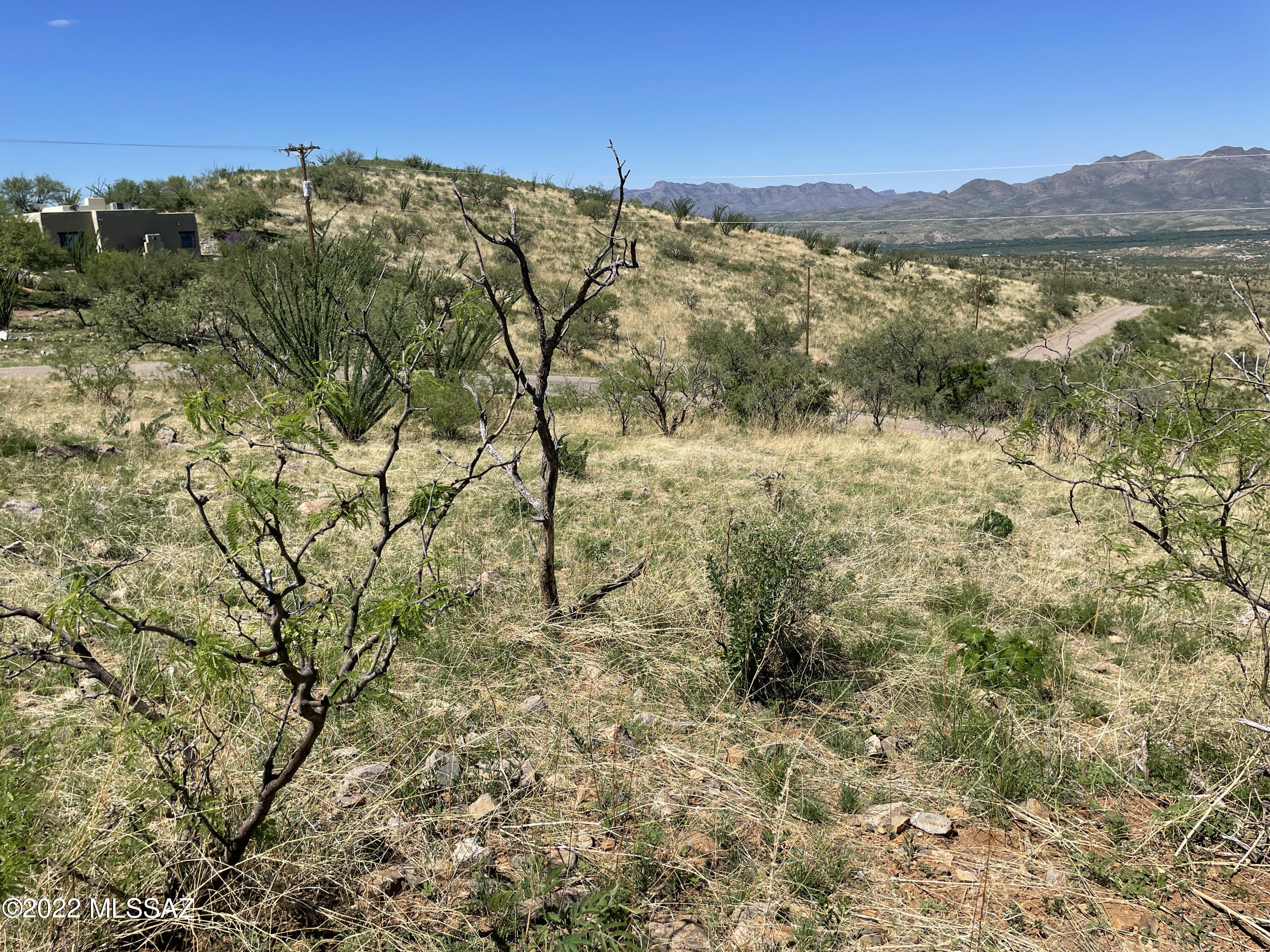 332 Dock Street, Unit 2 Rio Rico, AZ 85648 - Photo 5 of 6 a view of a lake with mountains in the background