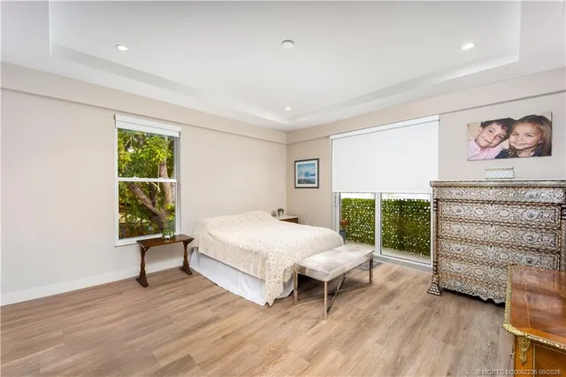 a spacious bedroom with a bed and a table