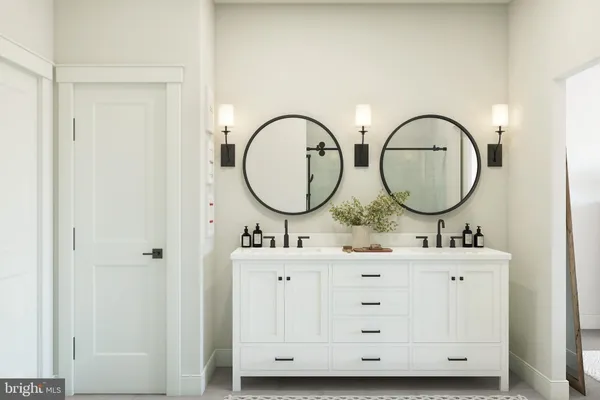 a bathroom with 2 sink and a mirror
