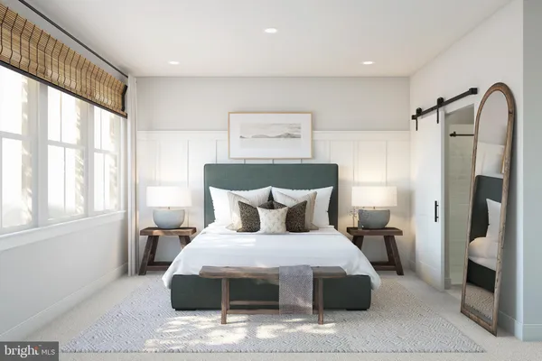 a bedroom with a large bed and a window