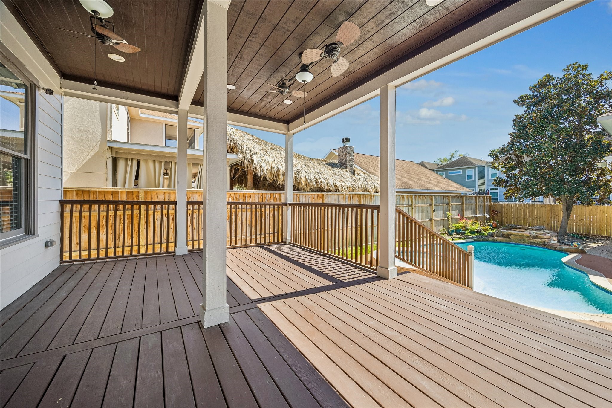 1408 West 23rd Street Houston, TX 77008 - Photo 37 of 40 Generous covered patio with wood ceiling detail, ideal for year-round outdoor entertaining.