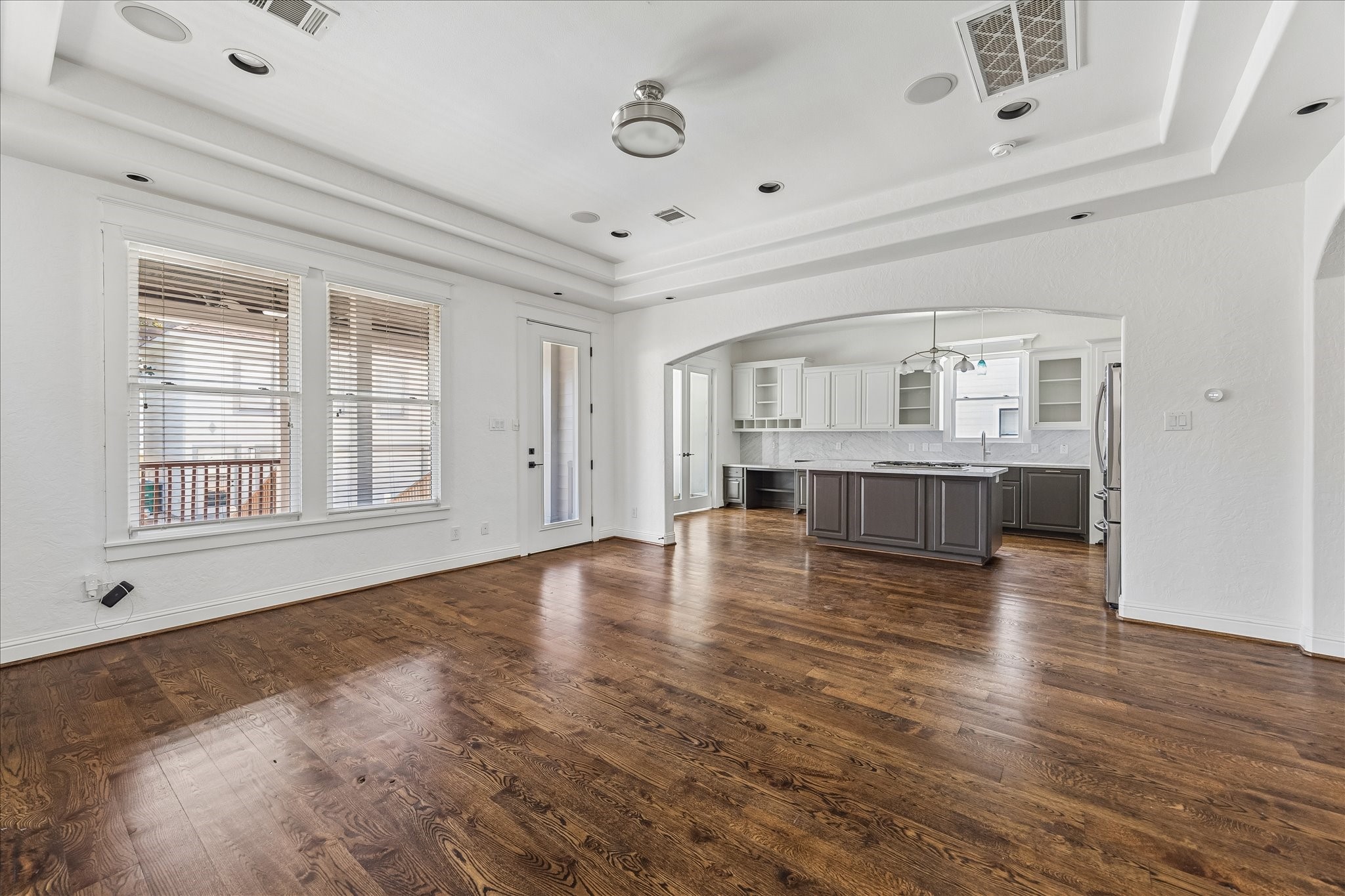 1408 West 23rd Street Houston, TX 77008 - Photo 4 of 40 Seamless open-concept living with sightlines from the family room into the beautifully appointed kitchen.
