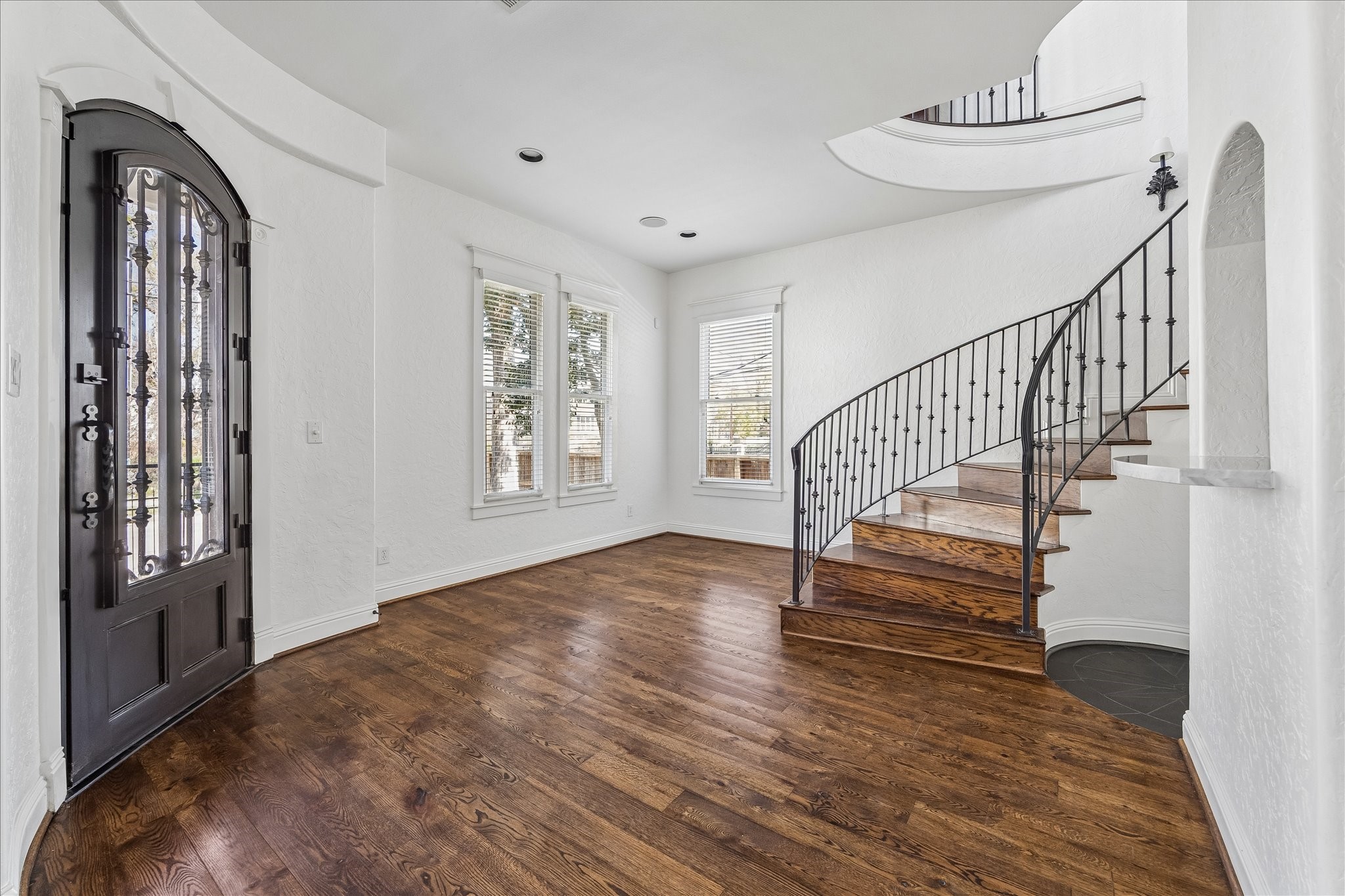 1408 West 23rd Street Houston, TX 77008 - Photo 9 of 40 Grand entry with wrought iron front door and sweeping staircase detail.