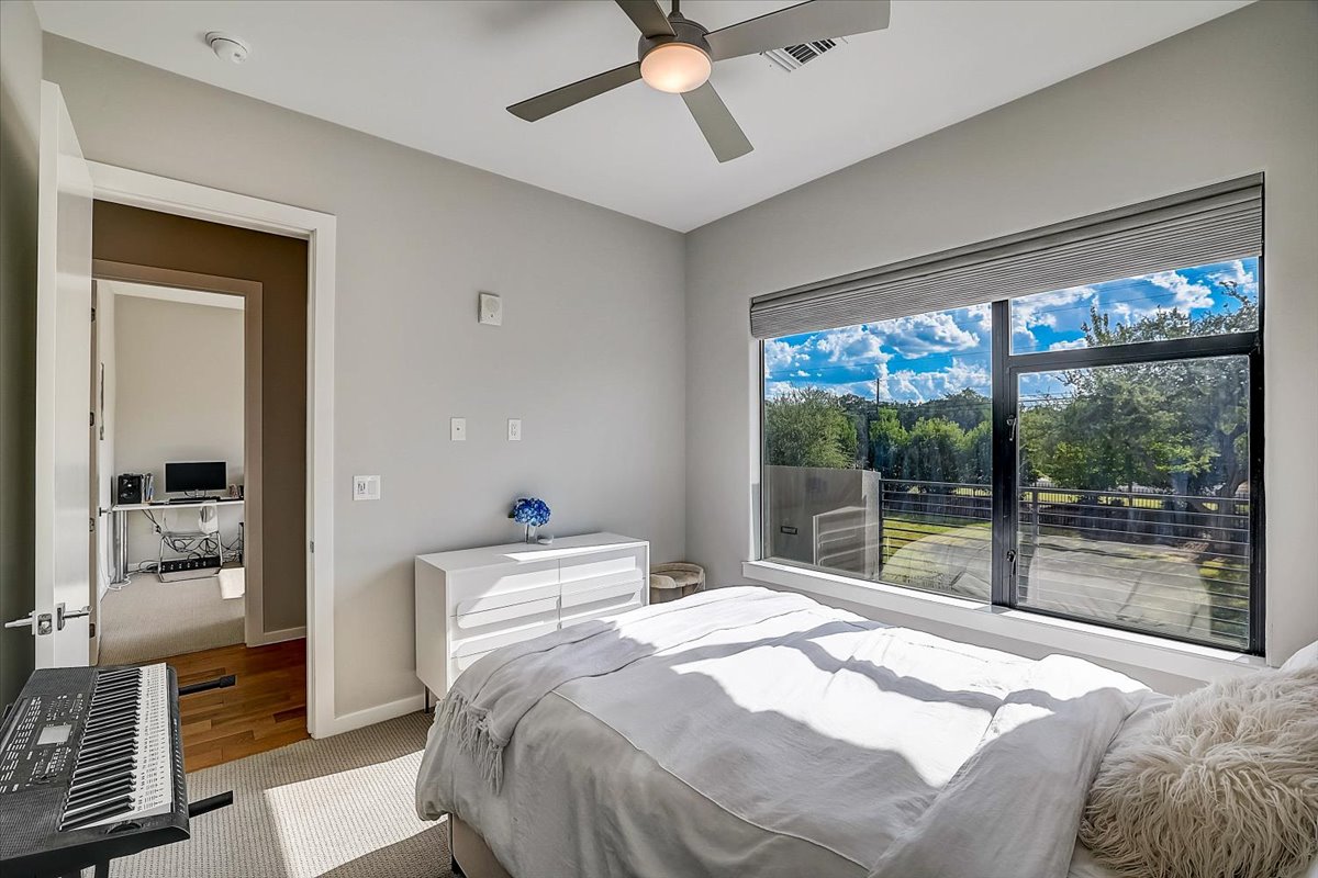 5921 Hiline Road, Unit 1204 Austin, TX 78734 - Photo 20 of 36 Bedroom with carpet and a ceiling fan