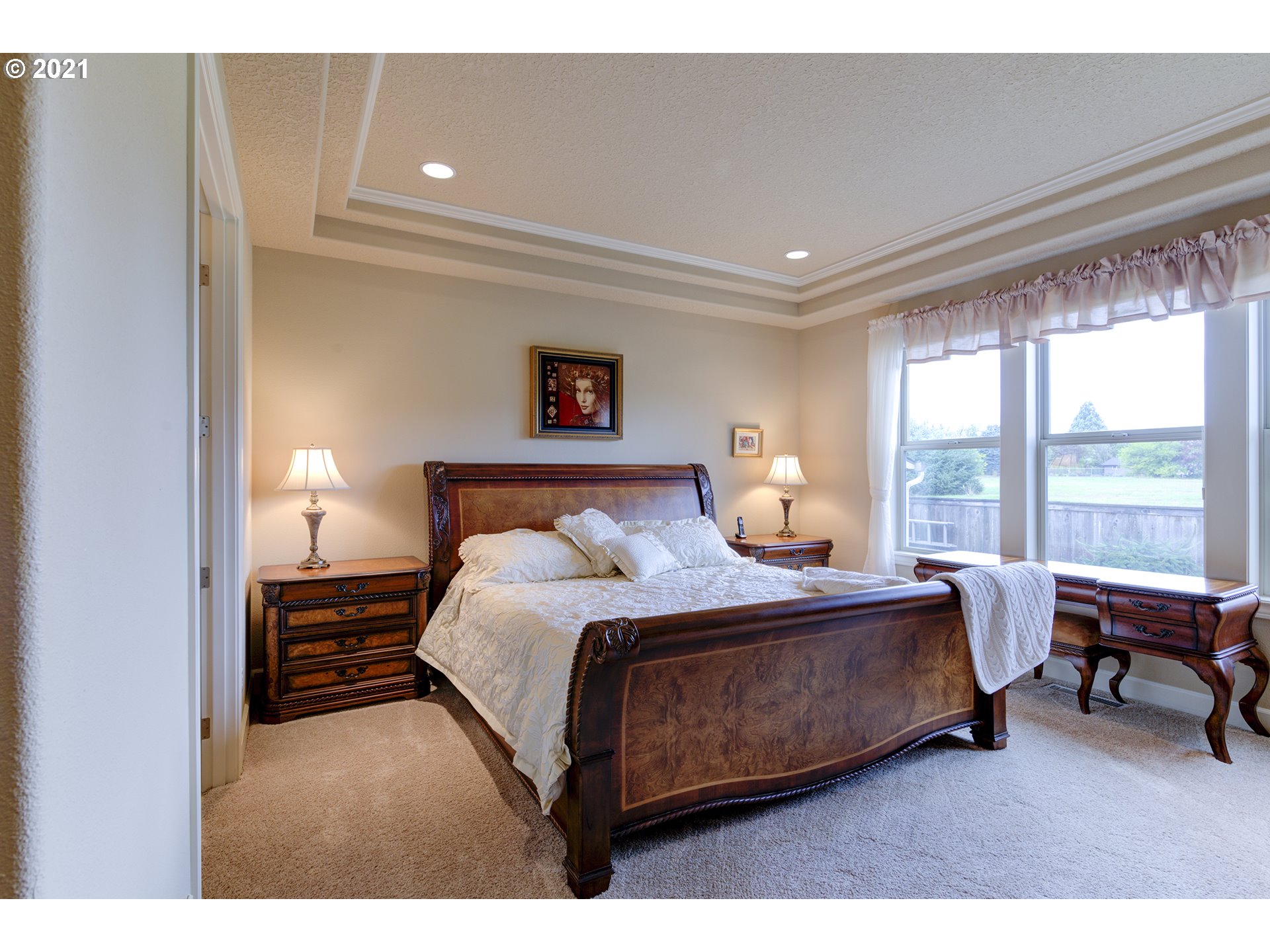 17315 Northeast 28th Court Ridgefield, WA 98642 - Photo 14 of 32 a bedroom with a bed lamps and window