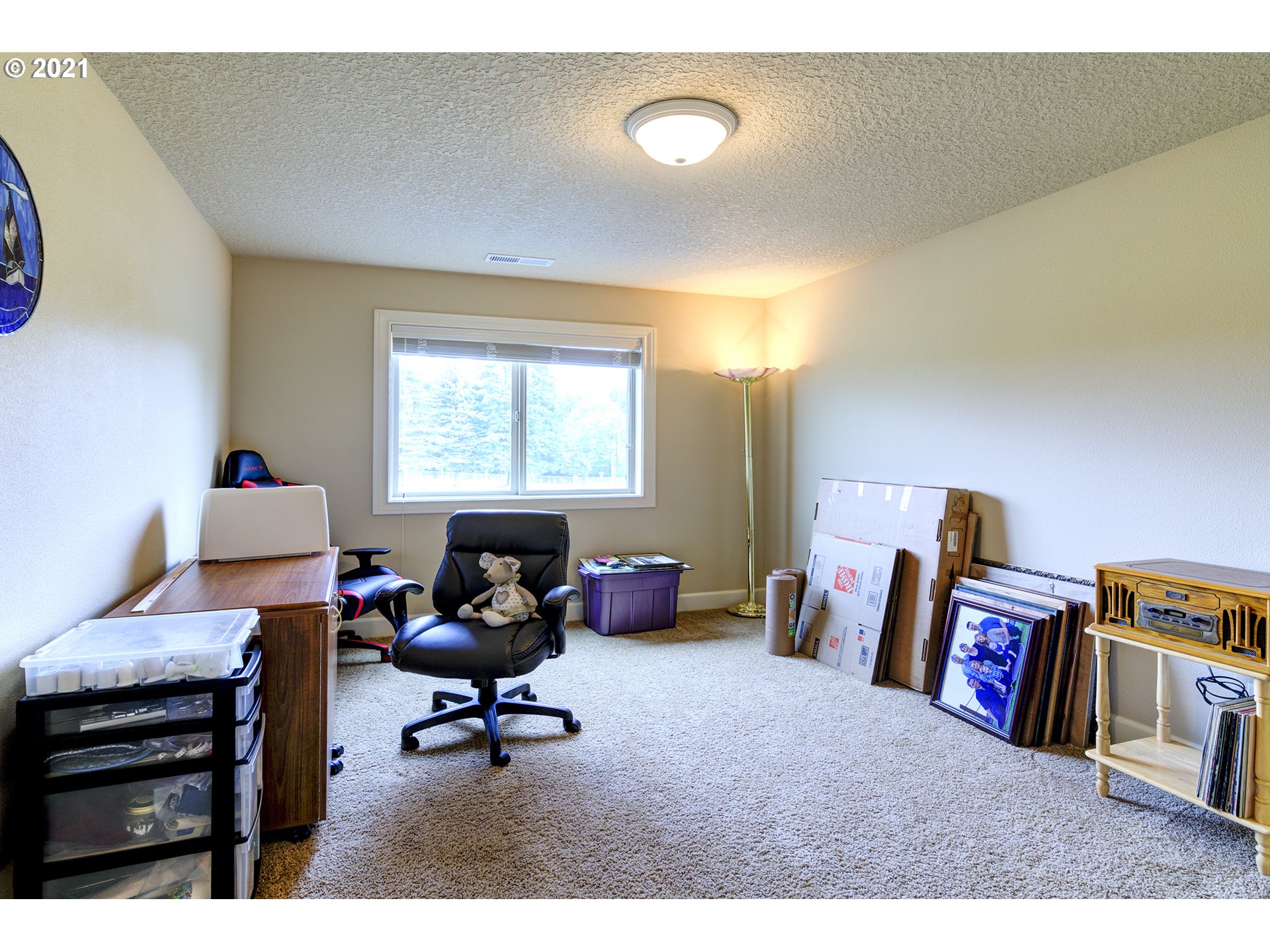 17315 Northeast 28th Court Ridgefield, WA 98642 - Photo 22 of 32 a living room with furniture and a bookshelf