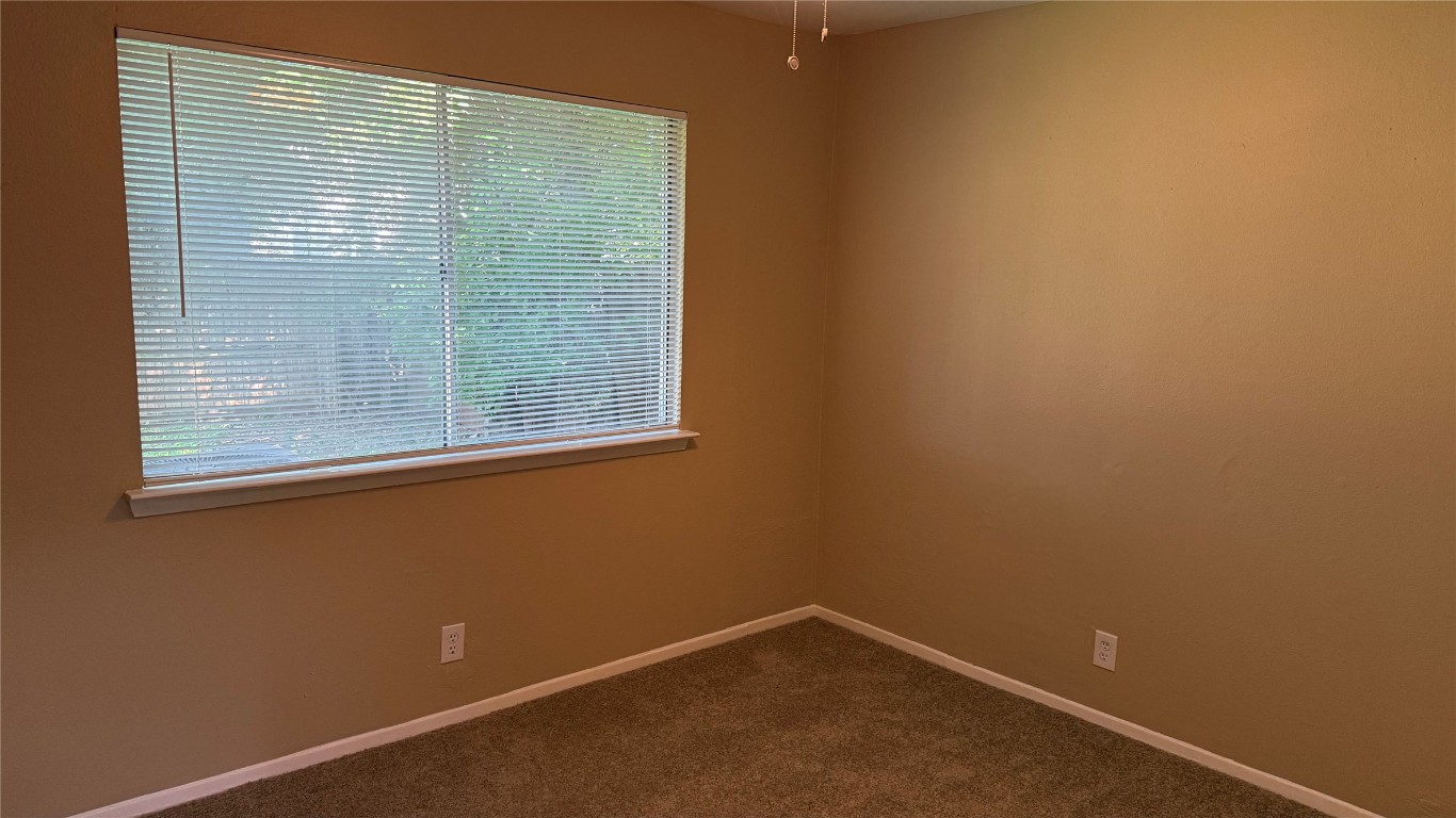 10400 Burmaster Lane, Unit A Austin, TX 78750 - Photo 12 of 20 a view of an empty room with a window