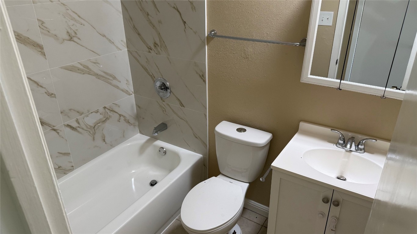 10400 Burmaster Lane, Unit A Austin, TX 78750 - Photo 15 of 20 a white toilet sitting next to a bathroom sink