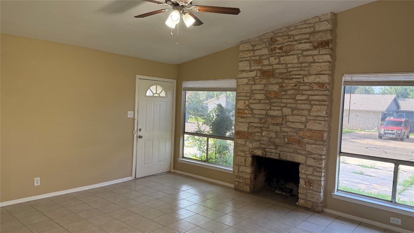 10400 Burmaster Lane, Unit A Austin, TX 78750 - Photo 2 of 20 a view of a livingroom with an empty space and a fireplace
