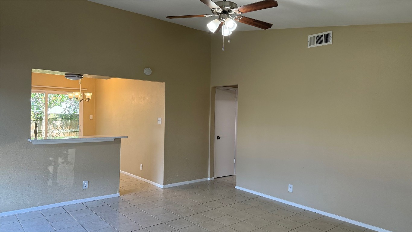 10400 Burmaster Lane, Unit A Austin, TX 78750 - Photo 4 of 20 an empty room with windows and fan