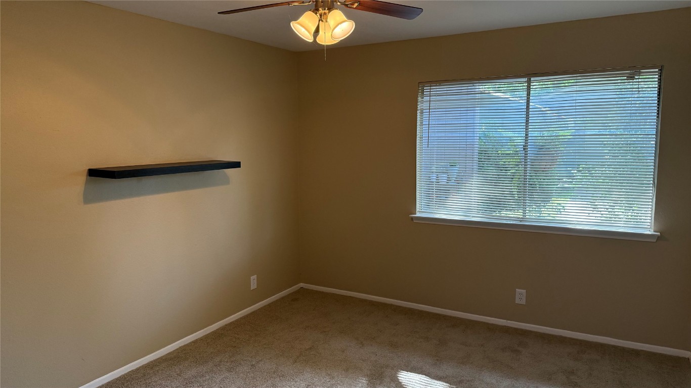 10400 Burmaster Lane, Unit A Austin, TX 78750 - Photo 7 of 20 a view of an empty room with a window