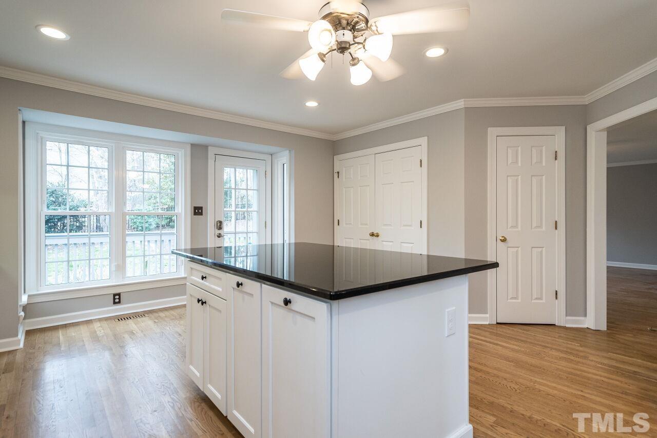 107 Needle Park Drive Cary, NC 27513 - Photo 13 of 29 a hallway with a large mirror and furniture