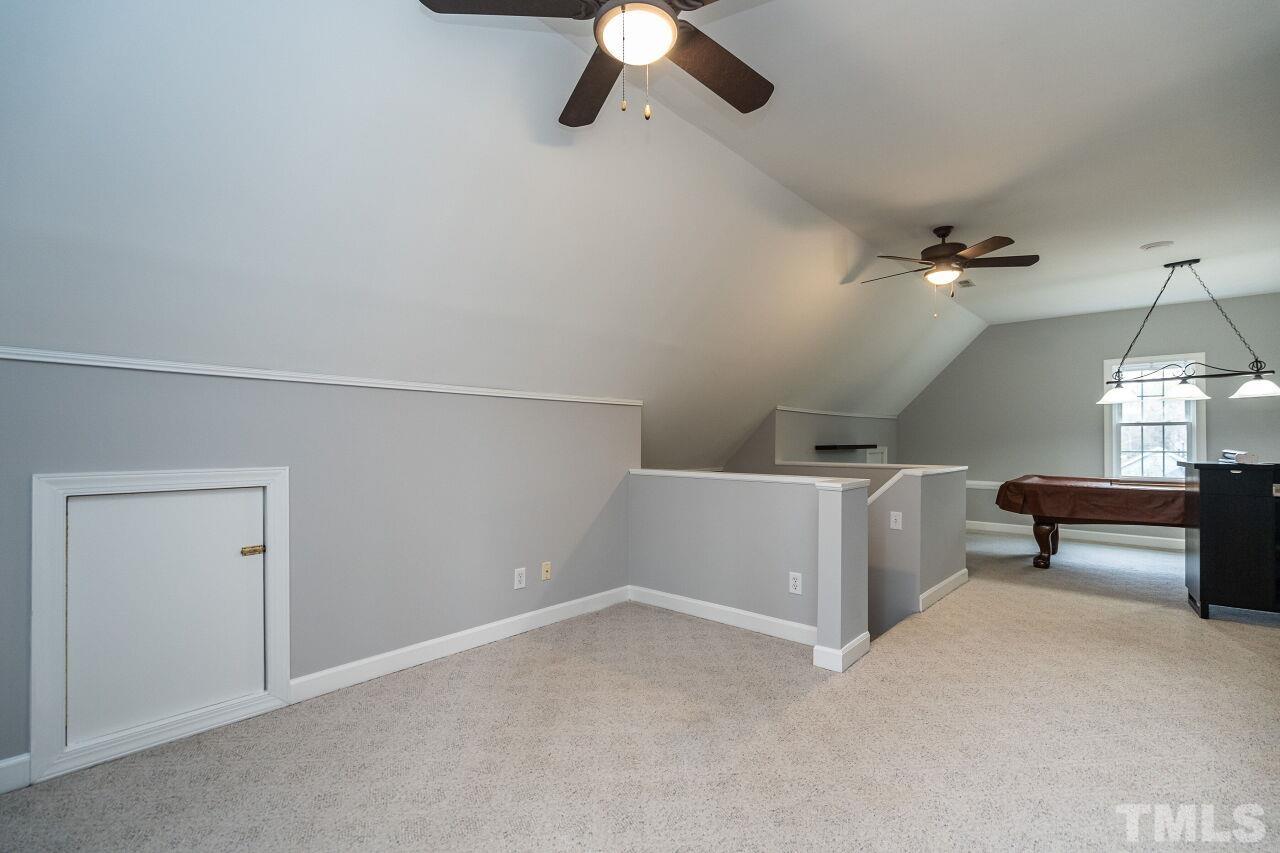 107 Needle Park Drive Cary, NC 27513 - Photo 21 of 29 a view of a livingroom with a ceiling fan and window