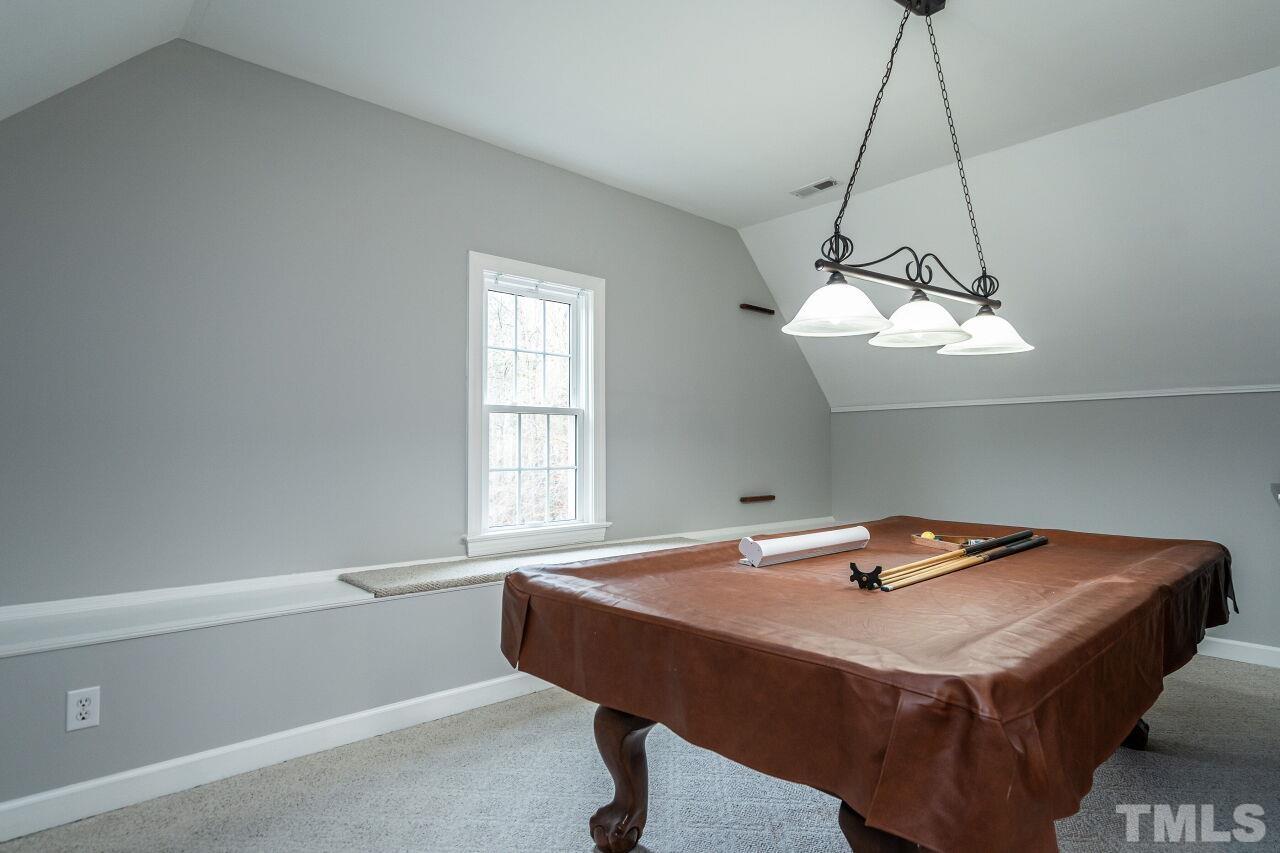 107 Needle Park Drive Cary, NC 27513 - Photo 23 of 29 a bedroom with a table and window