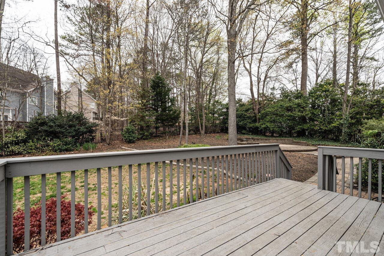 107 Needle Park Drive Cary, NC 27513 - Photo 24 of 29 a view of balcony with wooden floor and fence