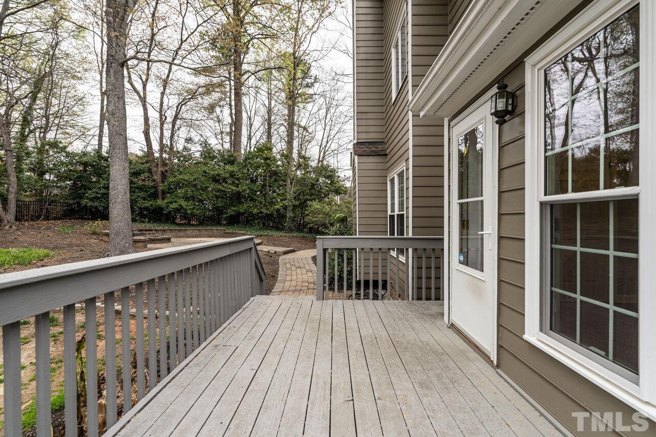 107 Needle Park Drive Cary, NC 27513 - Photo 25 of 29 a view of balcony with wooden floor and fence