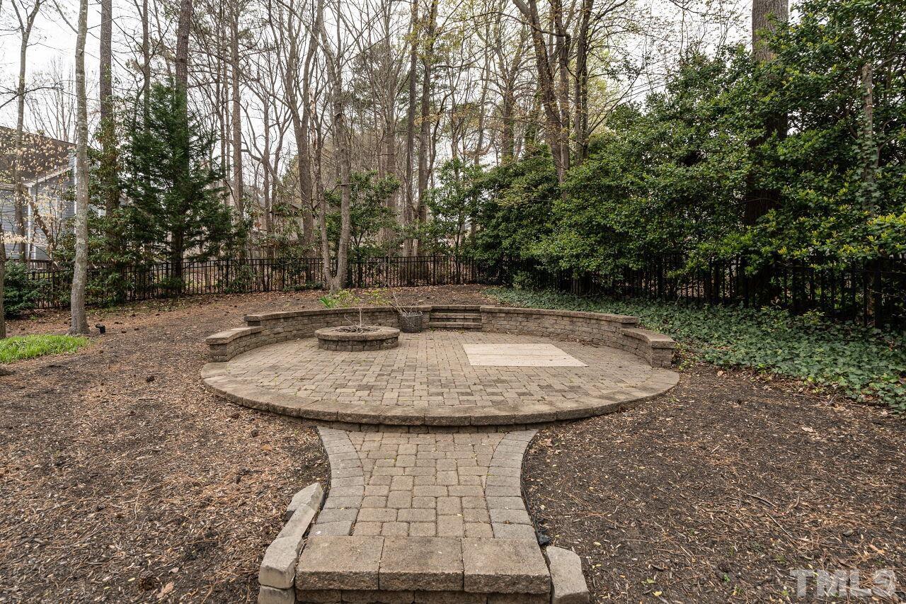 107 Needle Park Drive Cary, NC 27513 - Photo 27 of 29 a view of a swimming pool with a yard