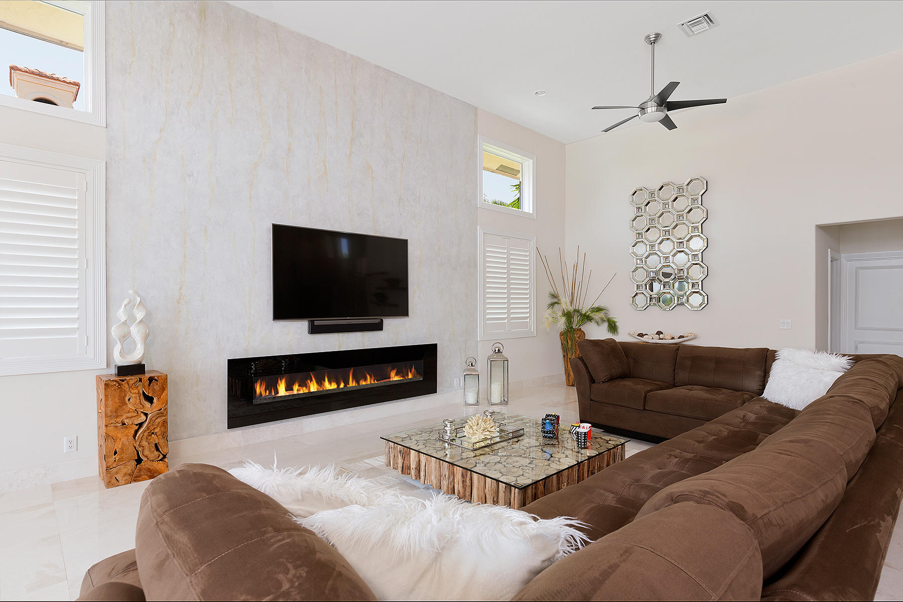 1612 Southwest 19th Avenue Boca Raton, FL 33486 - Photo 11 of 44 a living room with furniture and a flat screen tv