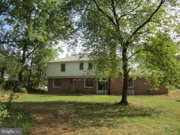 10702 Gainsborough Road Potomac, MD 20854 - Photo 3 of 4 a house view with a garden space