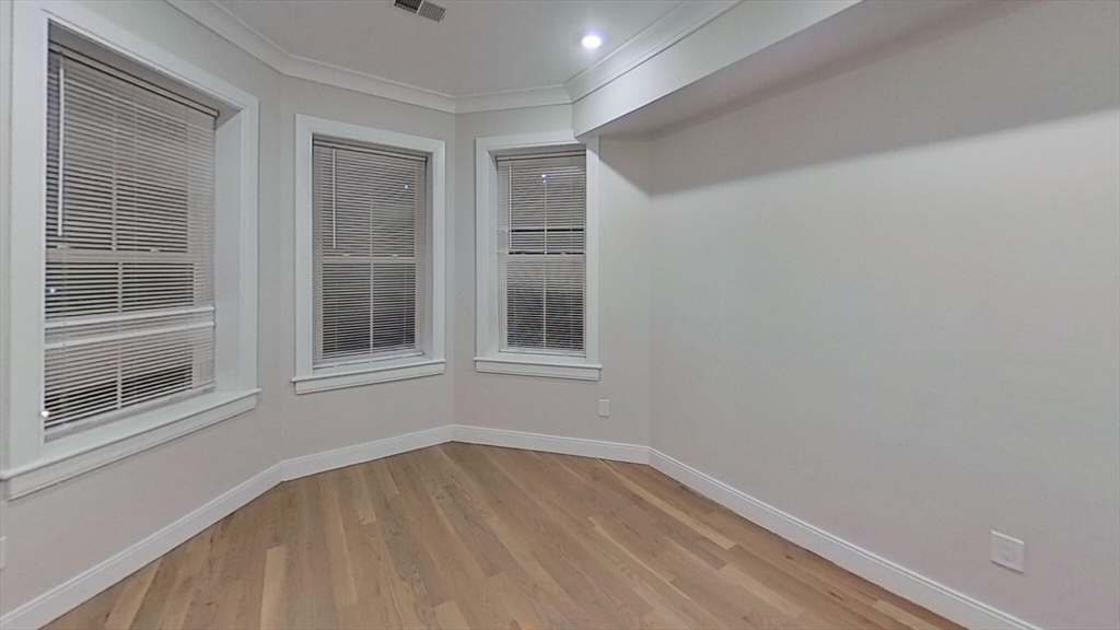 47 Englewood Avenue, Unit 1 Boston, MA 02135 - Photo 3 of 5 a view of empty room with windows