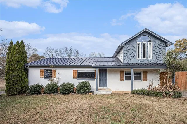front view of a house with a yard