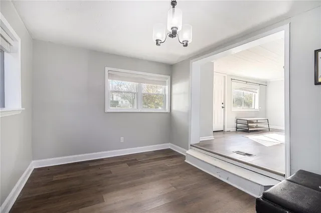 a very nice looking room with wooden floor