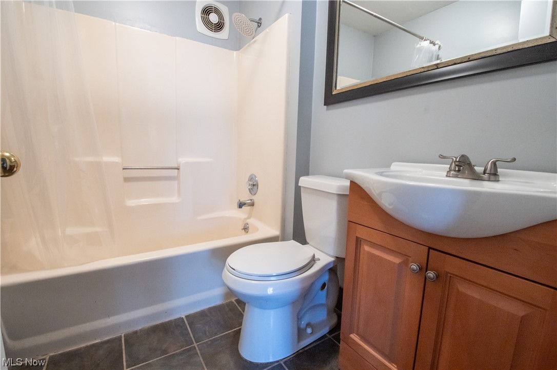 739 Som Center Road Cleveland, OH 44143 - Photo 13 of 36 Full bathroom featuring oversized vanity, toilet, tile flooring, and shower / tub combo
