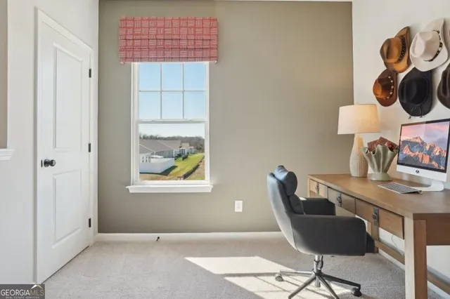 a workspace with furniture and window