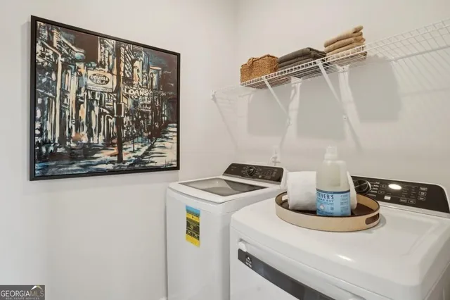 a kitchen with a refrigerator and a stove