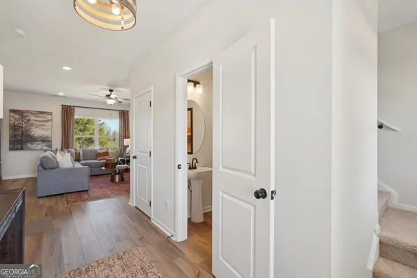 a view of bathroom with a sink and mirror