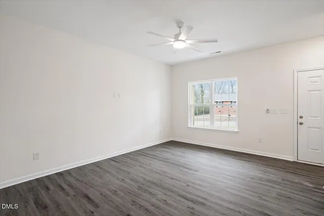 a kitchen with a sink cabinets and window