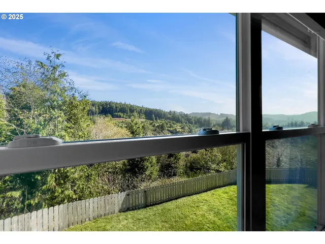 a view of balcony and yard