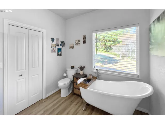 a bathroom with a toilet a sink and a mirror
