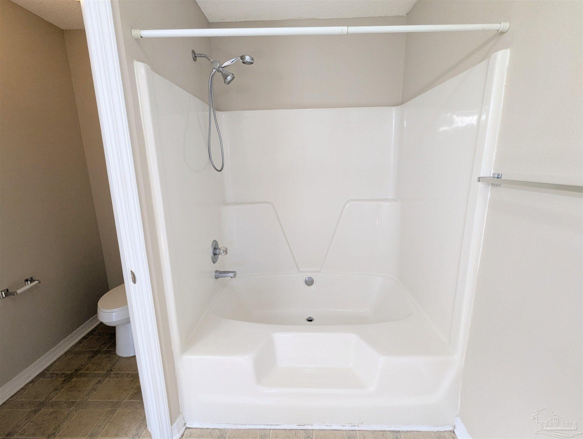 7108 Fitzpatrick Road Pensacola, FL 32526 - Photo 19 of 30 a bathroom with a bathtub and a shower