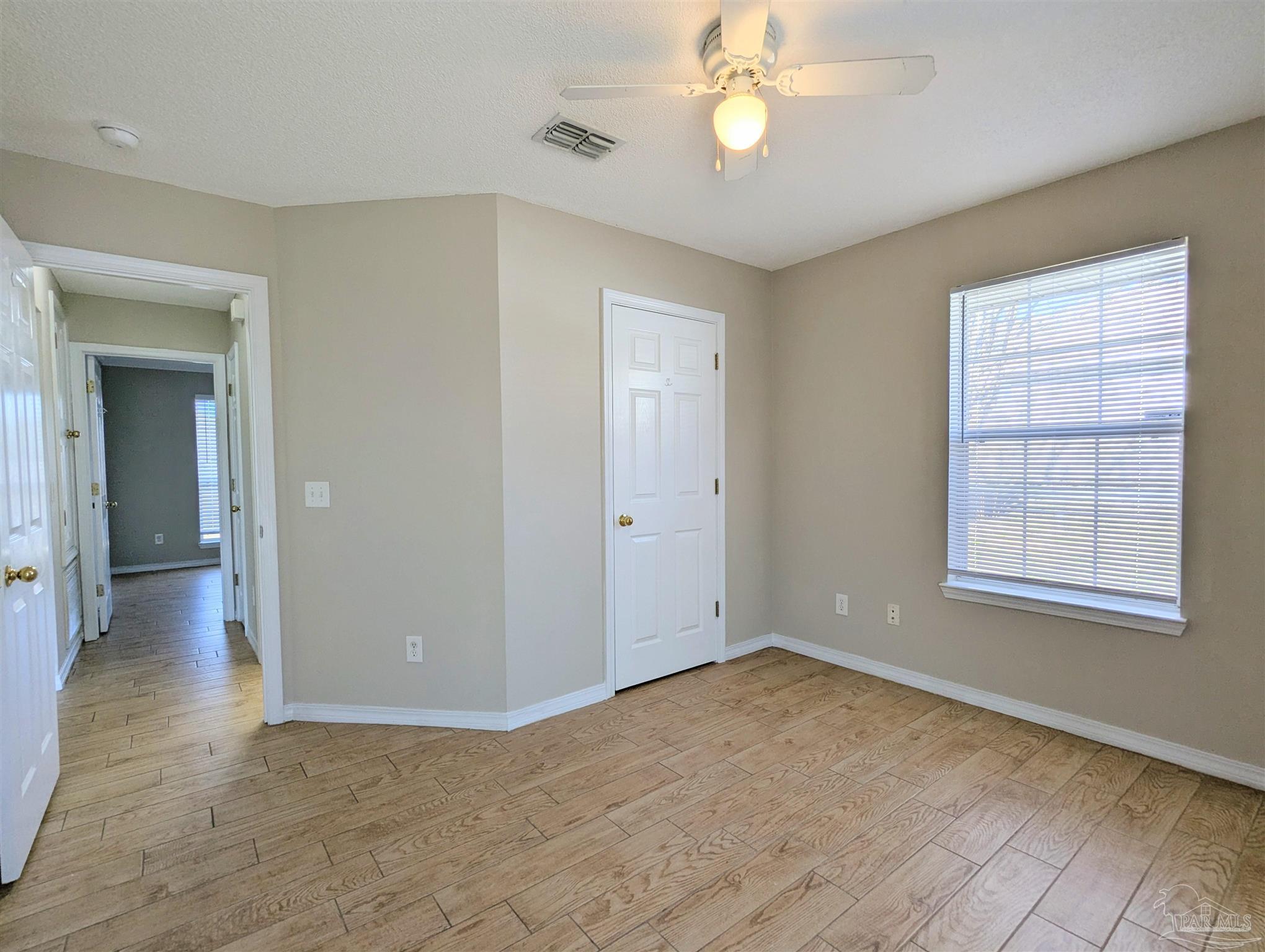 7108 Fitzpatrick Road Pensacola, FL 32526 - Photo 24 of 30 an empty room with windows and fan