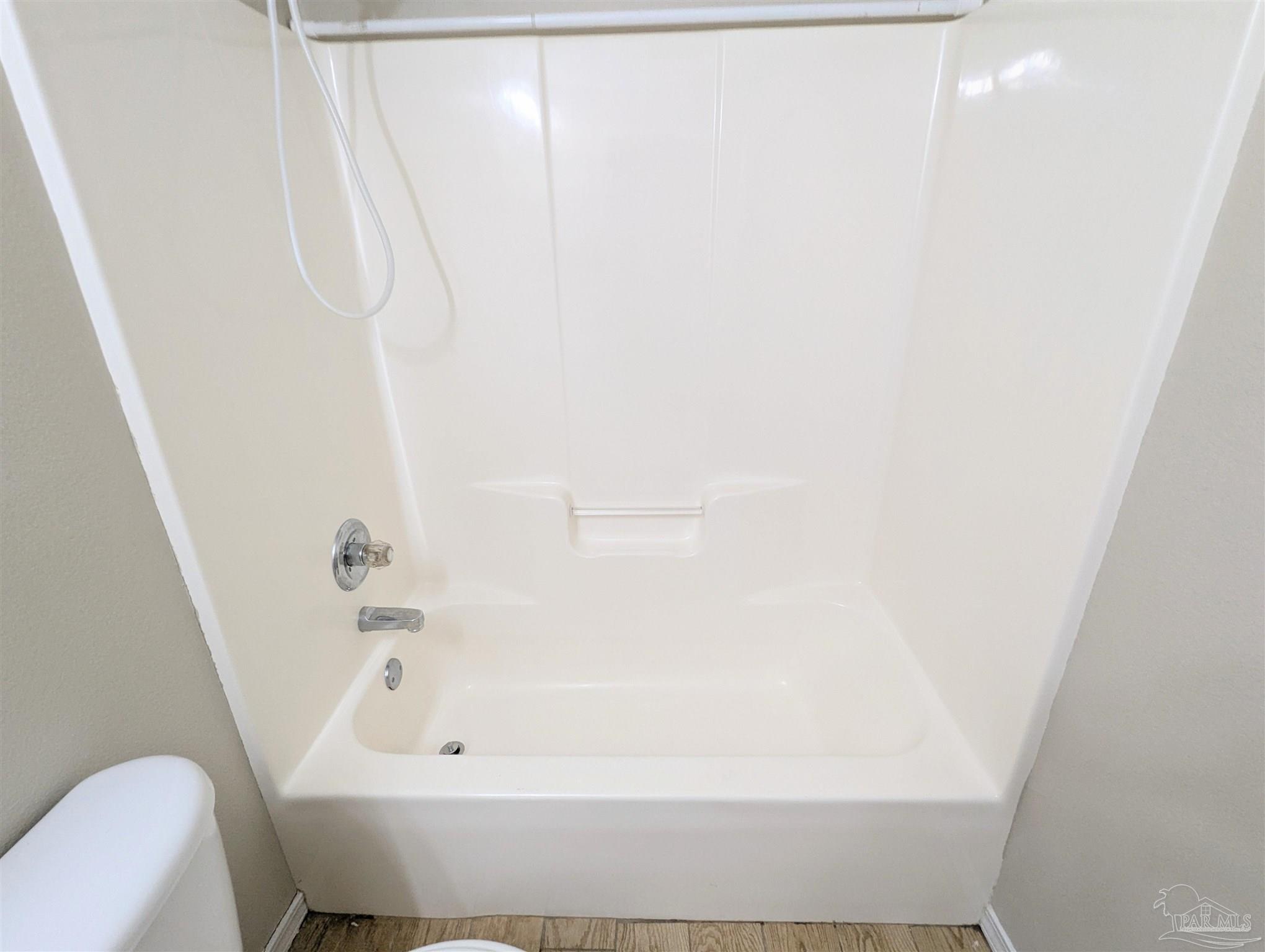 7108 Fitzpatrick Road Pensacola, FL 32526 - Photo 27 of 30 a bathroom with a bathtub and a shower