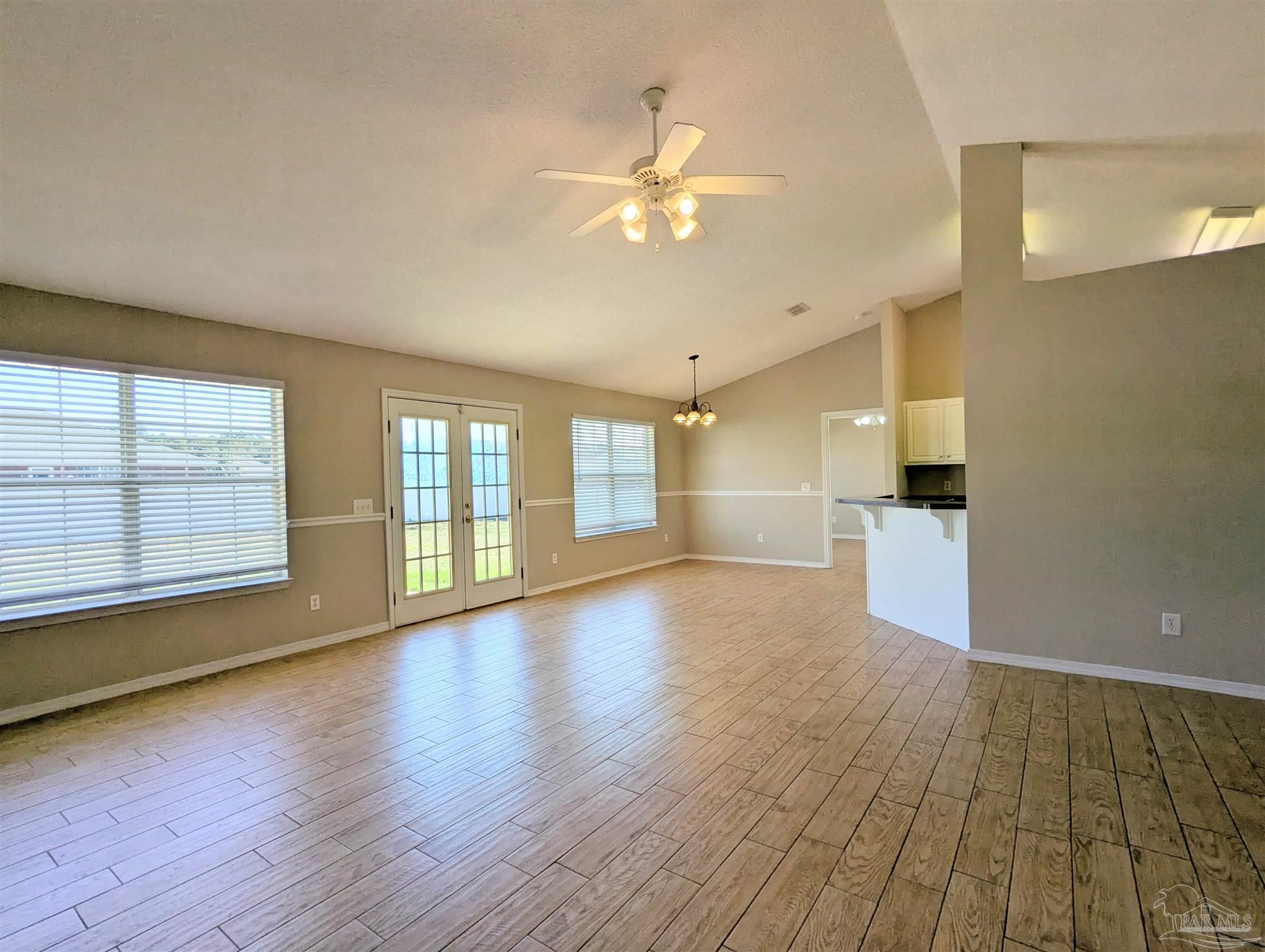 7108 Fitzpatrick Road Pensacola, FL 32526 - Photo 8 of 30 a view of empty room with wooden floor and fan