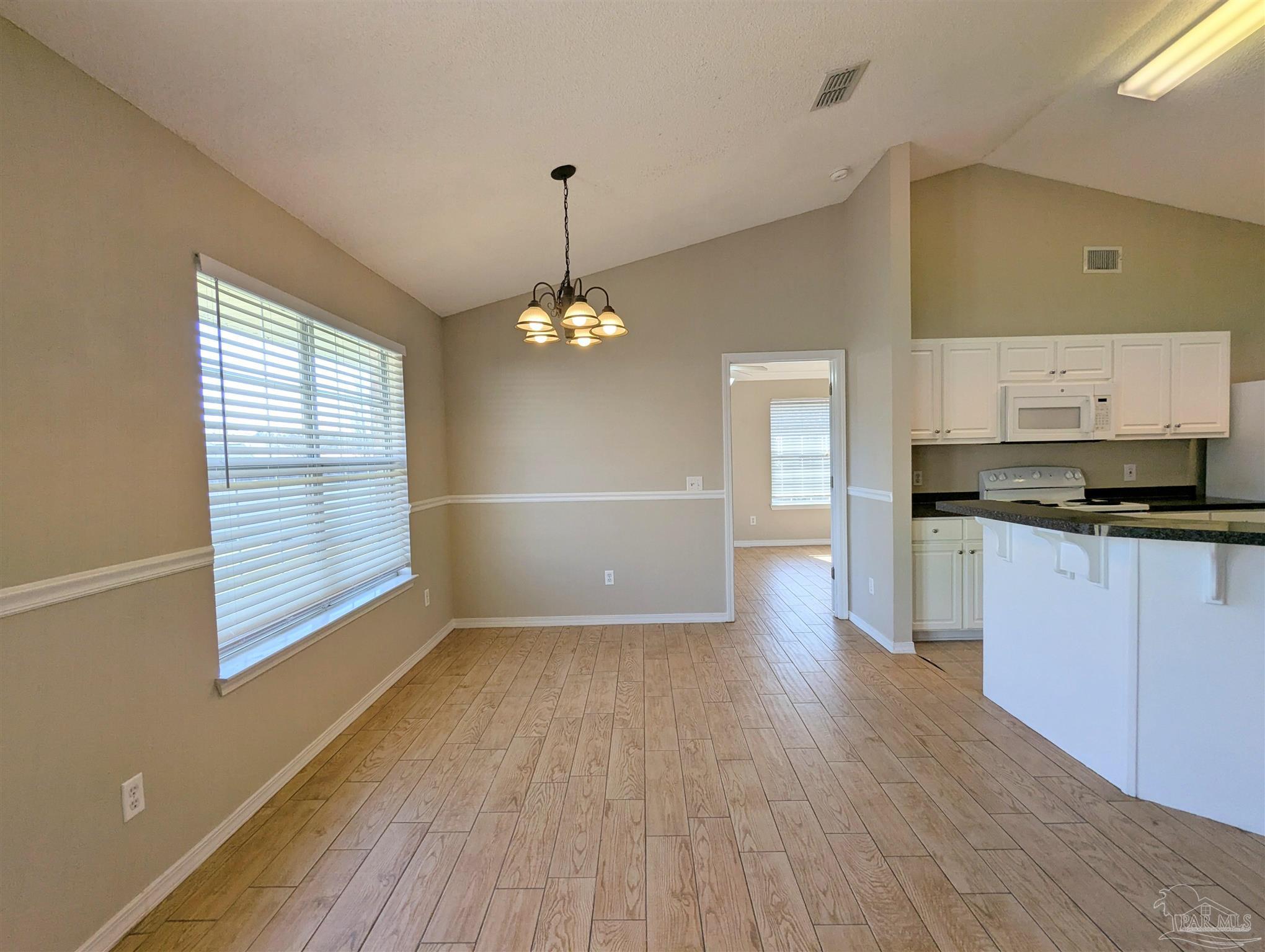 7108 Fitzpatrick Road Pensacola, FL 32526 - Photo 9 of 30 a view of kitchen with sink and wooden floor