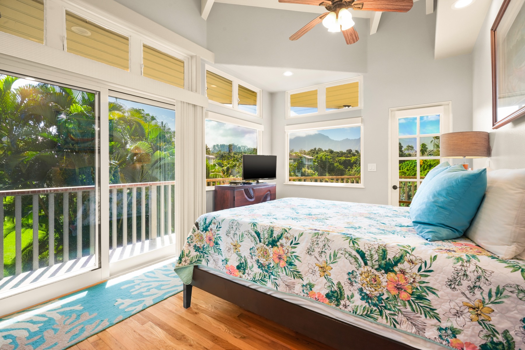 3564 Kaweonui Road Princeville, HI 96722 - Photo 16 of 30 a bedroom with a bed and wooden floor