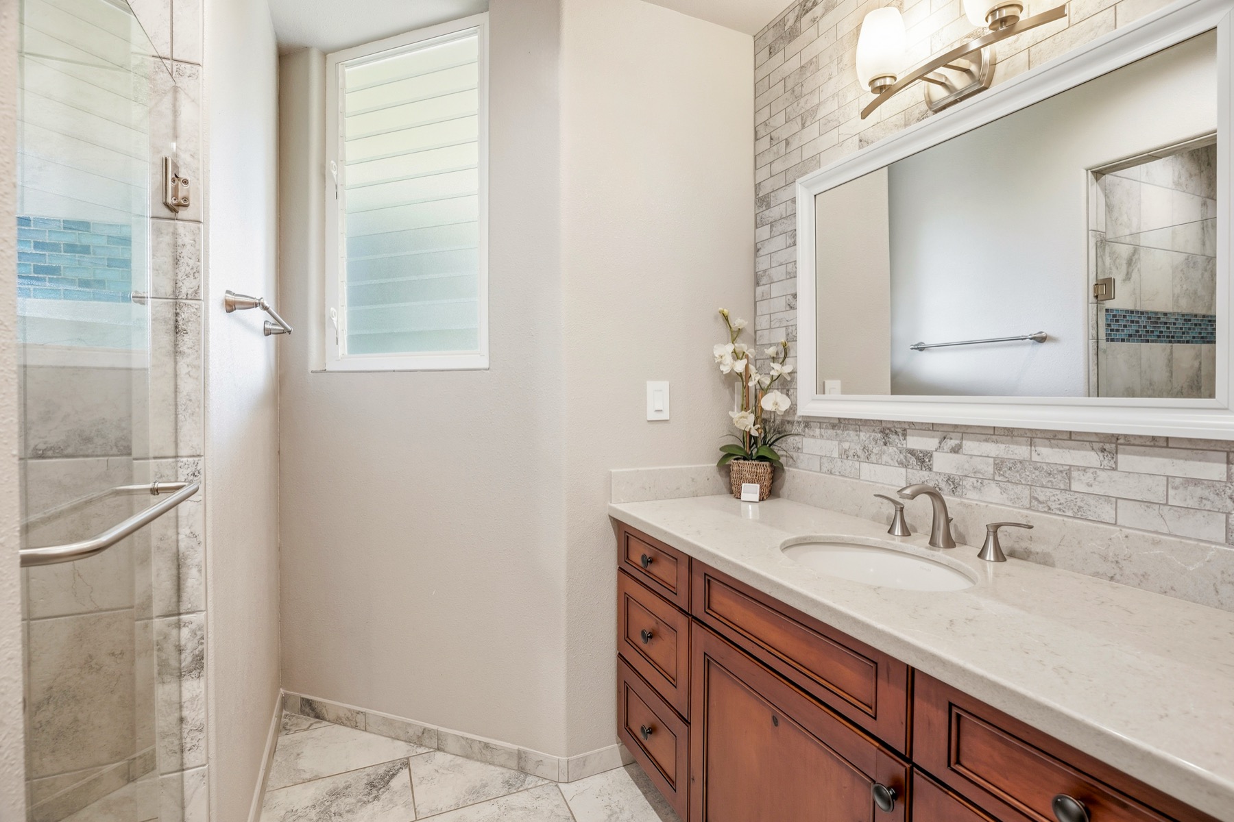 3564 Kaweonui Road Princeville, HI 96722 - Photo 21 of 30 a bathroom with a sink and a mirror
