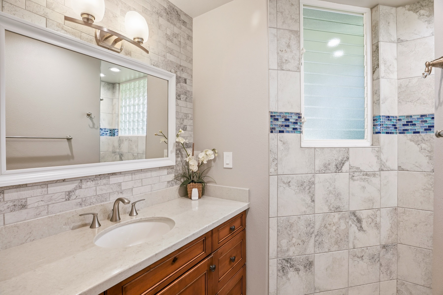 3564 Kaweonui Road Princeville, HI 96722 - Photo 23 of 30 a bathroom with a sink and a mirror