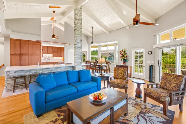 a living room with furniture a fireplace and a table
