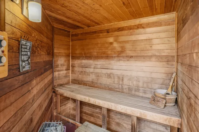 a bathroom with a shower and a sink